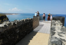 Visitors take advantage of the new viewpoint, gazing to Portrush to the West, and Dunluce Castle to the East